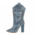 Western cowboy boot in denim blue with silver rhinestones, ornate stitched patterns, pointed toe and block heel by UnWritten Style.