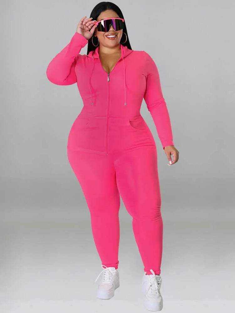 UnWritten Style pink tracksuit in smooth stretch fabric, featuring a fitted zip-front hoodie and tapered jogger pants.