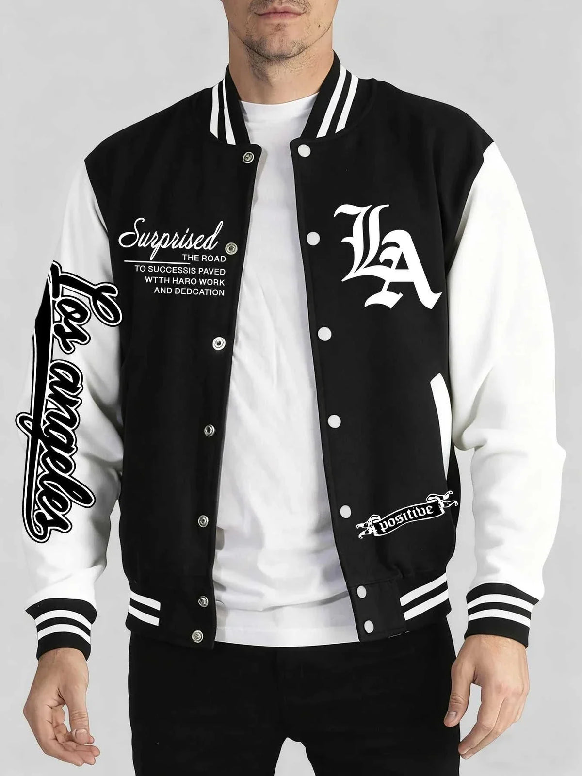 Varsity jacket in black and white with contrast sleeves, striped ribbing and Los Angeles Art Letter Prints on the chest and sleeve.