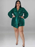 Royalty Sequin Blazer Romper in emerald green sequins, with long puff sleeves, a deep V-neck and belted waist.
