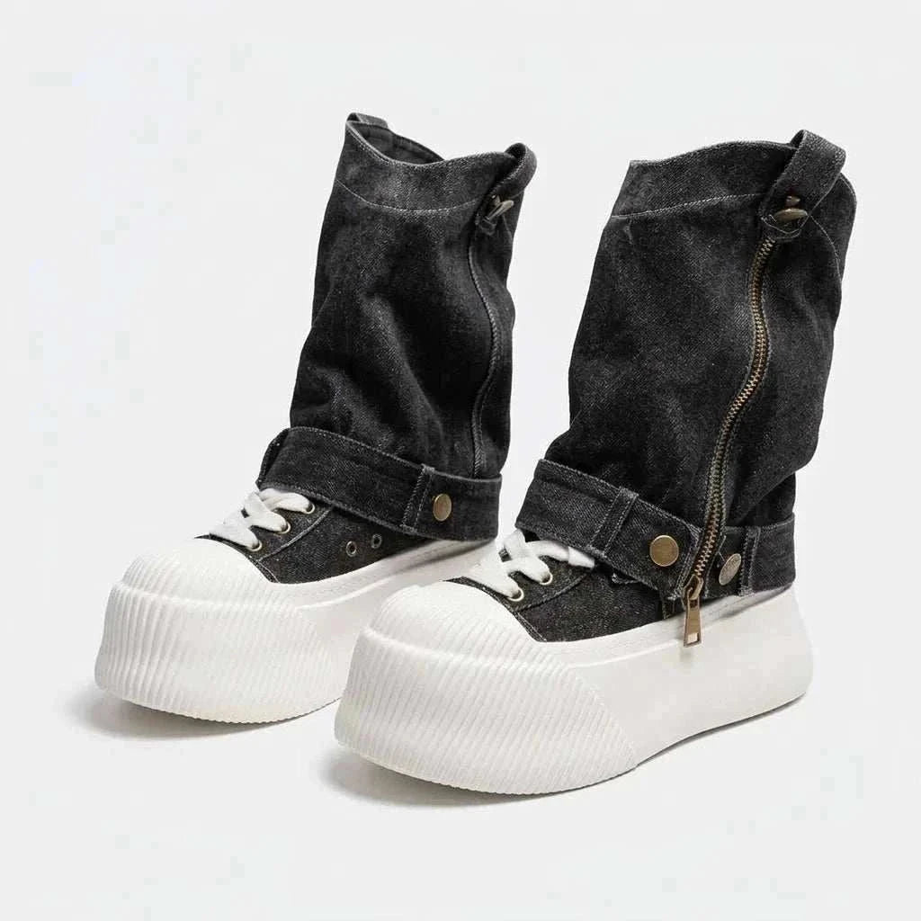 High-top Slouchy Boot in black denim with white laces, thick white platform soles, ankle straps, and side zippers