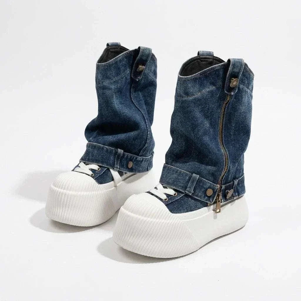 High-top Slouchy Boot in dark blue denim with white laces, chunky ribbed white platform soles, and a side zipper