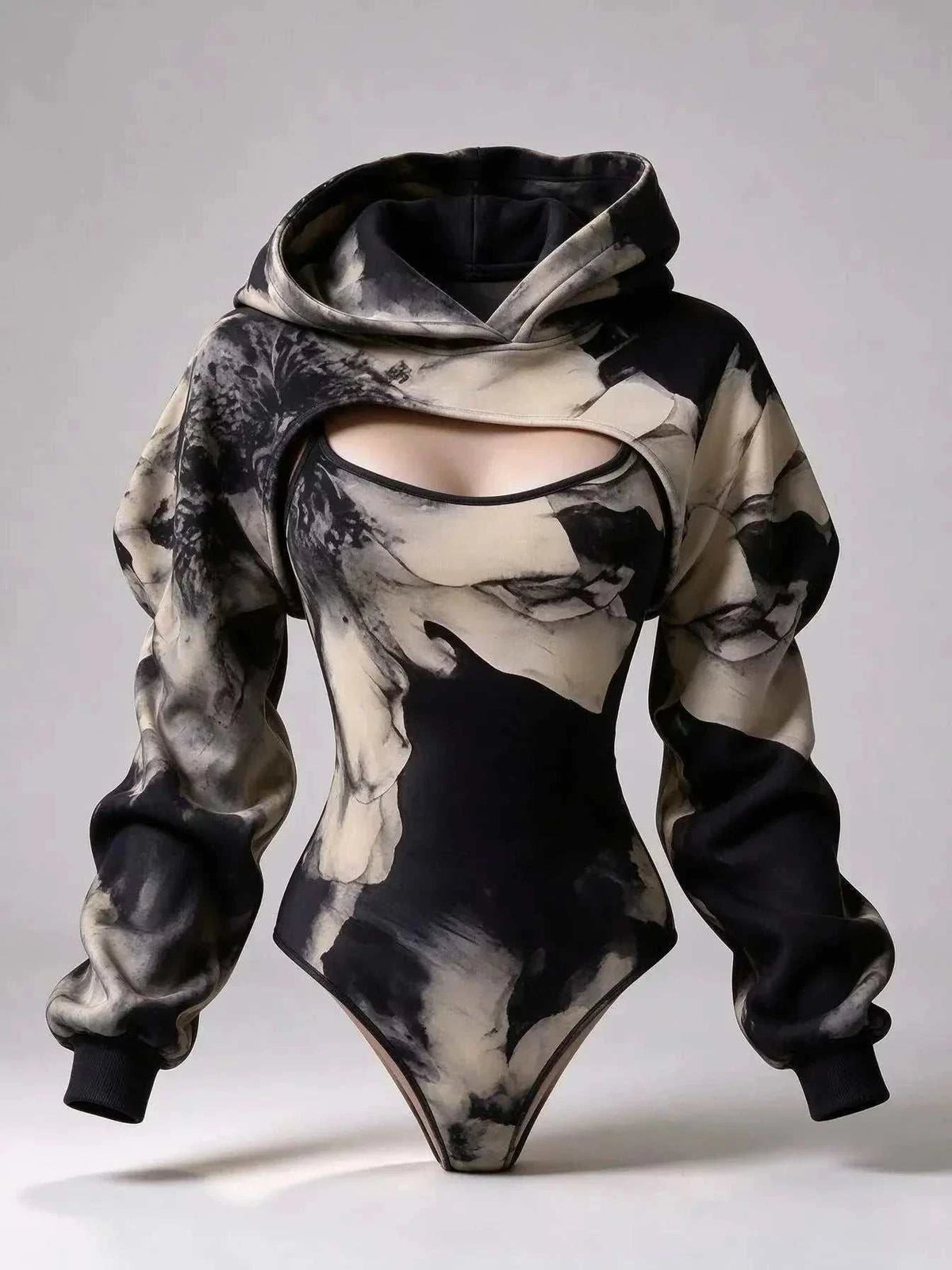 UnWritten Style hoodie bodysuit in black, gray, and ivory abstract print, with chest cutout and oversized sleeves