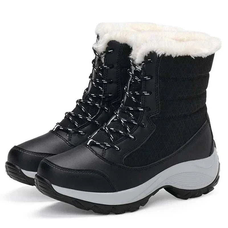 Unwritten Style — Cozy Luxe Winter Boots in black synthetic material with white faux-fur trim, lace-up fronts and chunky soles.