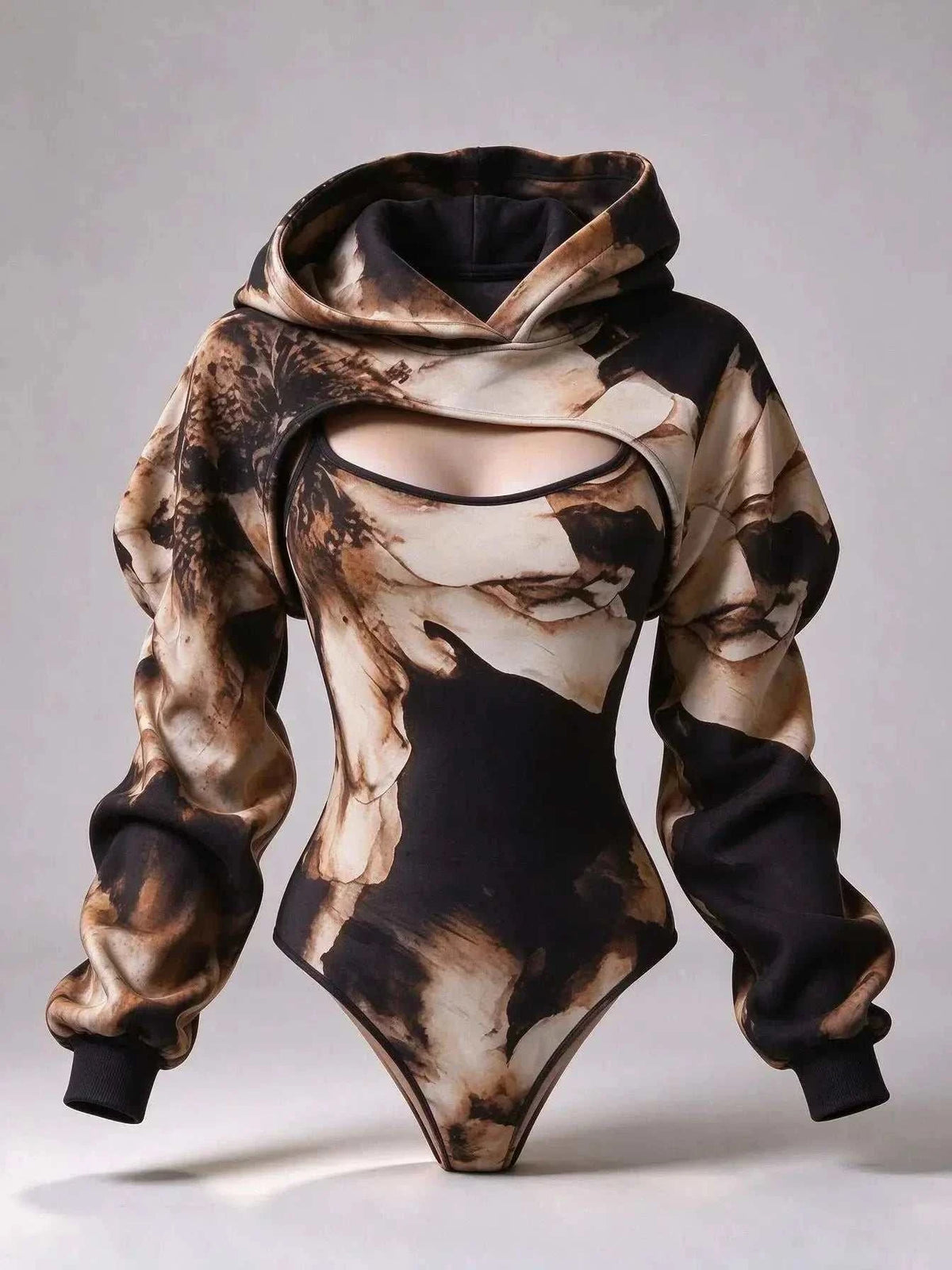 UnWritten Style hoodie bodysuit in black, cream, and brown abstract print, with a chest cutout and oversized sleeves