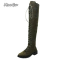 UnWritten Style over-the-knee boot in olive suede-look material with full-length crisscross lacing and a low block heel